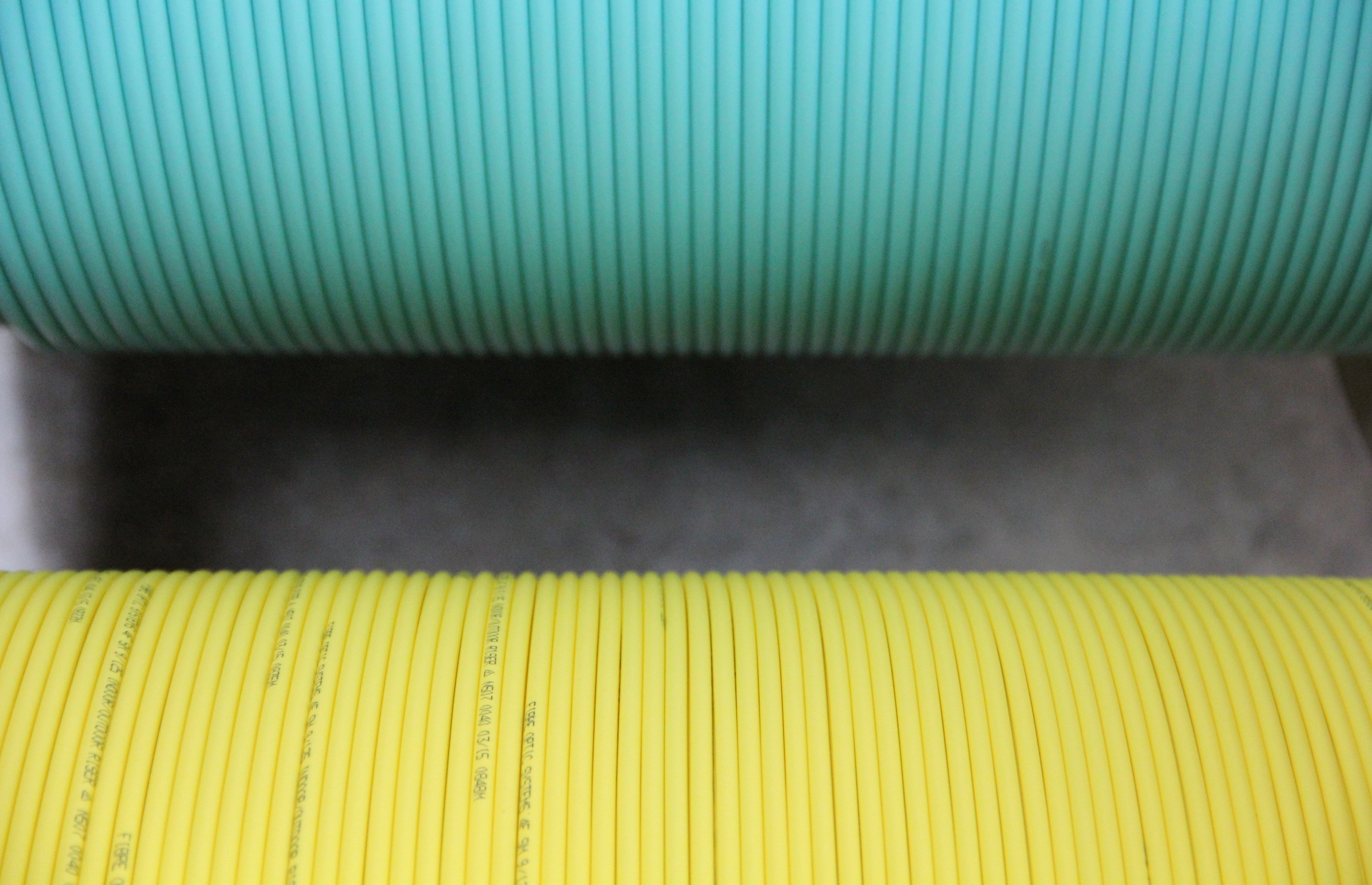 Two cable drums top in green and yellow.